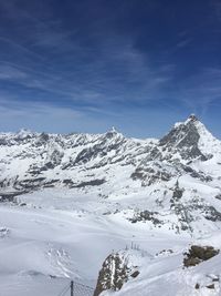 Scenic view of snow covered mountains