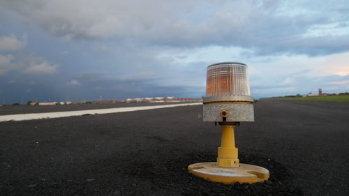 Surface level of road sign against sky