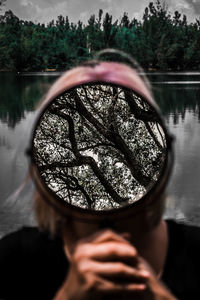 Reflection of person on sunglasses