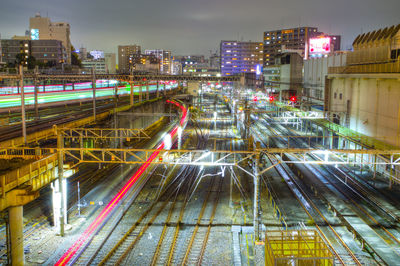 High angle view of light trails on railroad at night