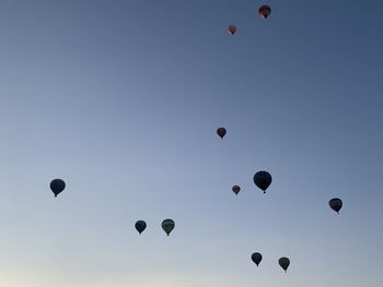 Low angle view of hot air balloons against sky in pamukkale