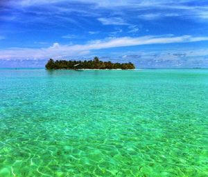 Scenic view of sea against blue sky