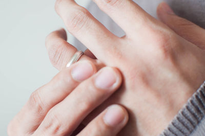 Close-up of woman holding wedding ring