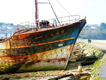 Boats moored on sea against sky