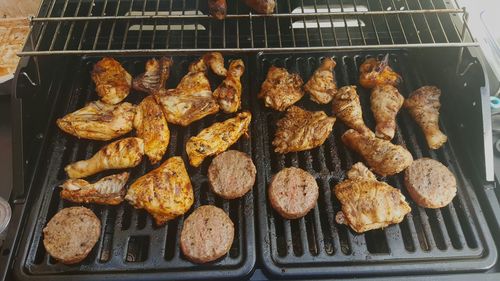 High angle view of meat on barbeque