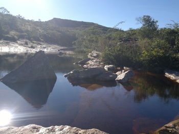 Scenic shot of reflection of mountains in calm river