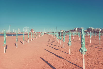 Panoramic view of beach against clear blue sky