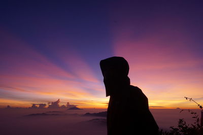 Silhouette of man at sunset
