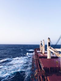 Ship in sea against clear sky