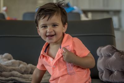 Portrait of cute baby boy playing at home