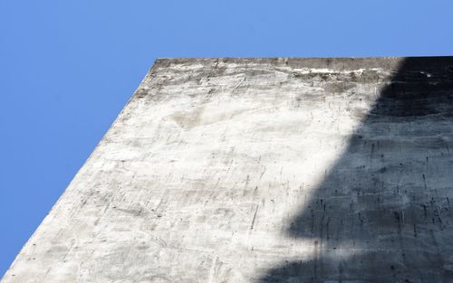 Low angle view of historical building against blue sky