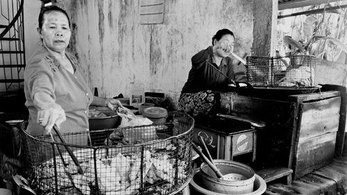 Man and woman standing in kitchen