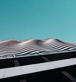 Low angle view of building against clear blue sky