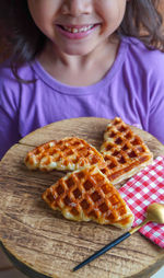 Close-up of girl eating food