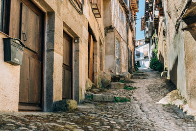 Narrow street amidst old buildings in town