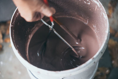 Close-up of hand holding ice cream