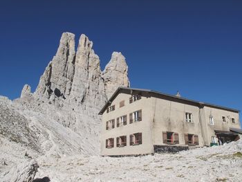 Low angle view of built structure against blue sky