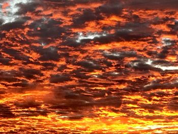 Low angle view of dramatic sky during sunset