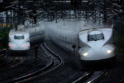 Tokaido shinkansen n700a passing through maibara station at rainy day