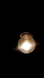 Low angle view of lit lamp