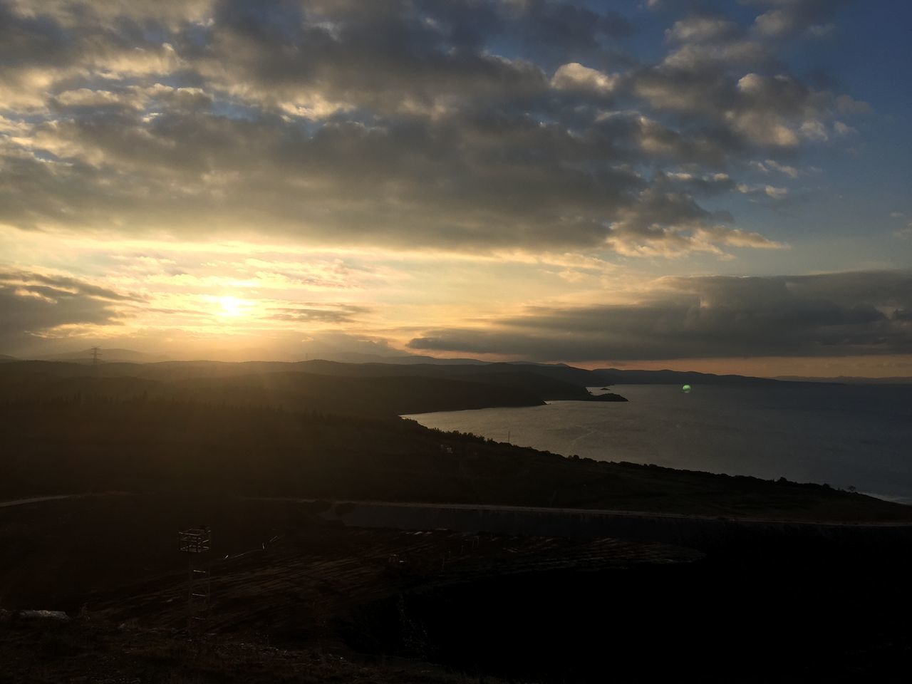 sunset, sky, water, scenics, tranquil scene, tranquility, beauty in nature, sea, cloud - sky, nature, silhouette, idyllic, cloud, sun, cloudy, mountain, reflection, dusk, shore, outdoors