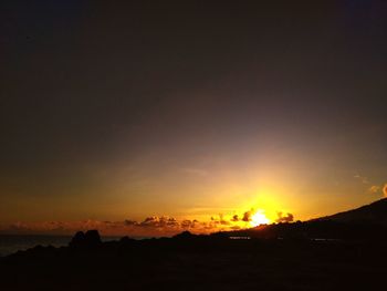 Scenic view of silhouette landscape against sky during sunset