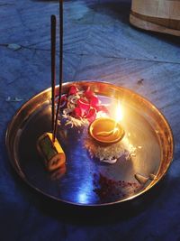 High angle view of illuminated lamp on table