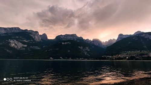 Scenic view of lake against sky during sunset