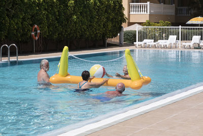 Family enjoying in swimming pool
