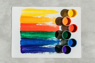 High angle view of various paint on table