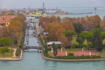 Basketball fields in the biennale gardens near a canal, venice, italy