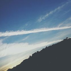 Scenic view of landscape against blue sky