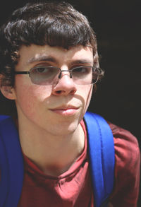 Portrait of young man wearing eyeglasses outdoors
