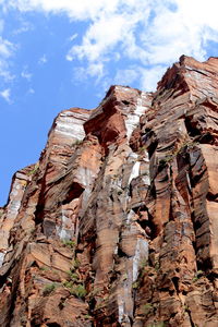 Low angle view of rock formation against sky