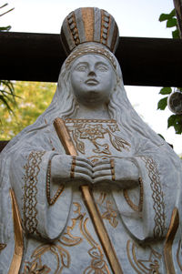 Low angle view of angel statue against temple