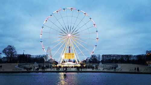 Low angle view of ferris wheel against sky