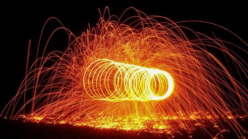 Light painting against sky at night