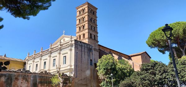 Low angle view of historic building against clear blue sky