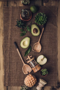 Directly above shot of avocado with container on table