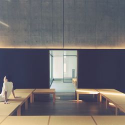 Rear view of woman walking in building