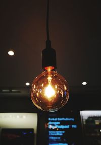 Low angle view of illuminated light bulb