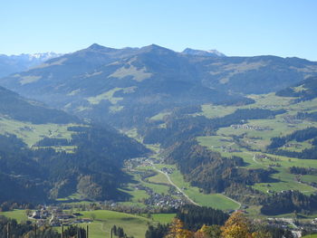 Scenic view of mountains against clear blue sky