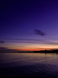 Scenic view of sea against romantic sky at sunset