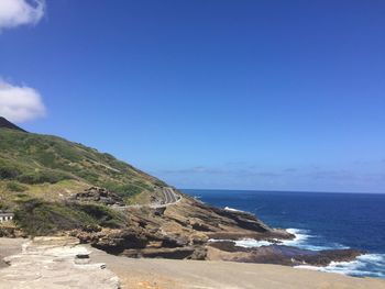 Scenic view of sea against clear blue sky