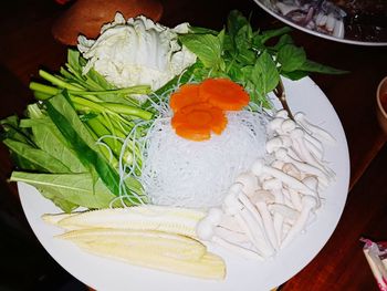 High angle view of chopped vegetables on table