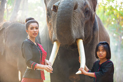 Full length of mother and daughter in zoo