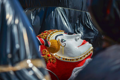 Close-up of mask in traditional clothing