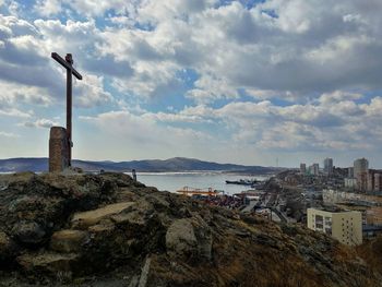 Panoramic view of sea and buildings against sky