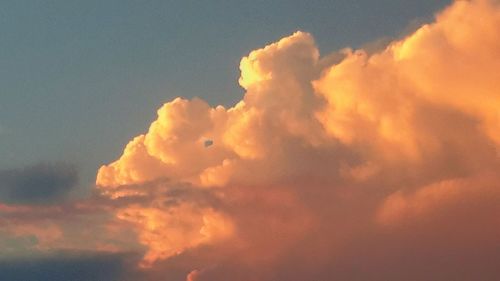 Low angle view of cloudy sky at sunset