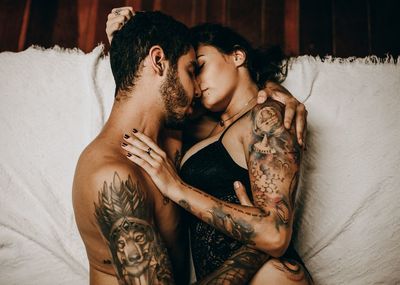 Young couple lying on bed at home